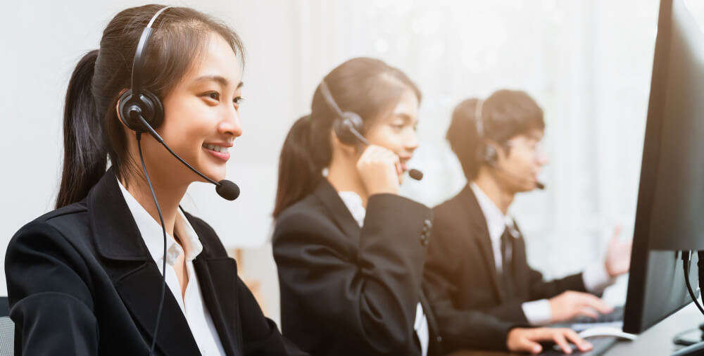 luag ntxhi-asian-businesswoman-consultant-wearing-microphone-headset-customer-support-phone-operator-workplace-1